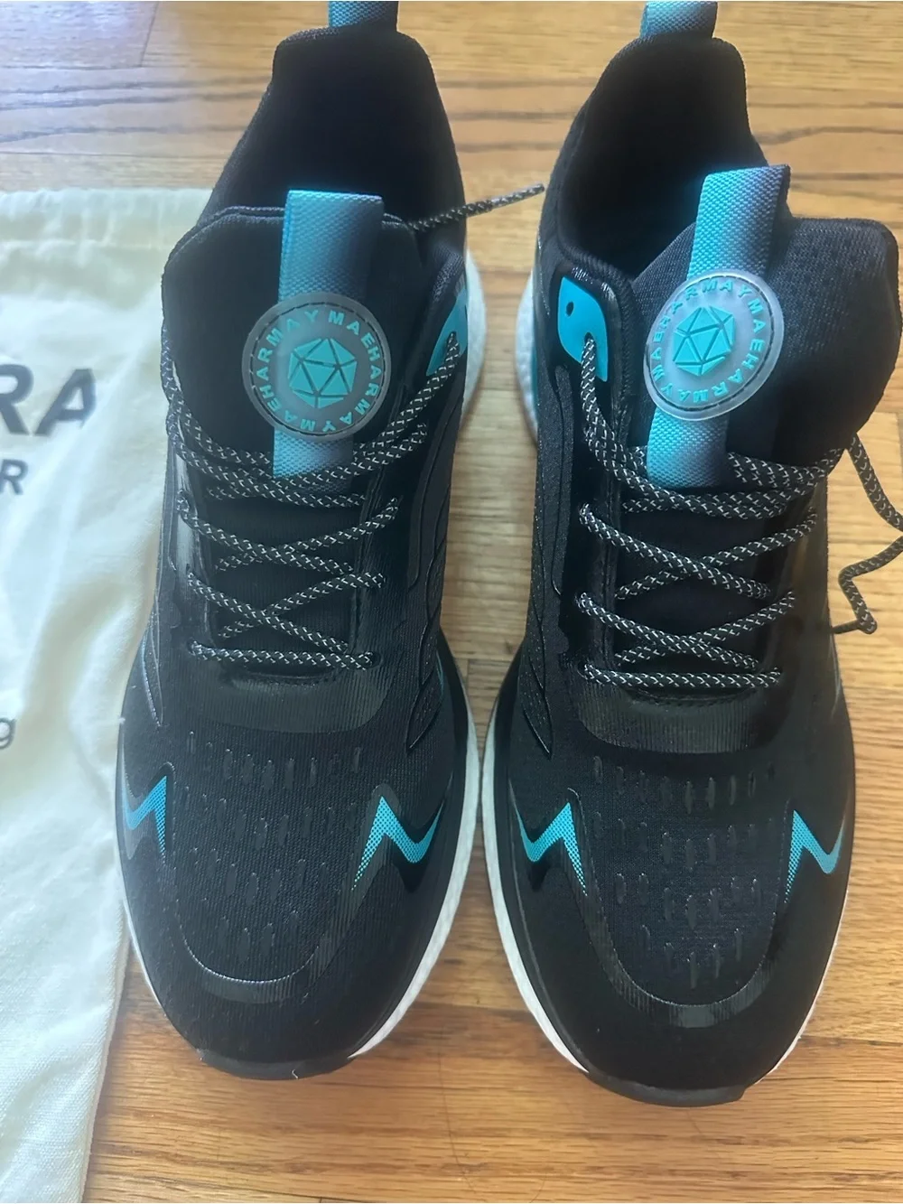 Orthora Black Sneakers with Teal Accents